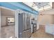 Kitchen with stainless steel refrigerator and white cabinetry at 12307 W Westgate Dr, Sun City West, AZ 85375