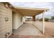 Covered patio with wooden beams and lattice at 13001 N 111Th Dr, Youngtown, AZ 85363