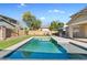 Inviting backyard pool with grassy area and patio at 13134 N 153Rd Dr, Surprise, AZ 85379