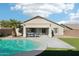 Inviting backyard oasis with a sparkling pool and patio at 13733 W Luke Ave, Litchfield Park, AZ 85340