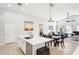 Open concept kitchen with island and view into living room at 13733 W Luke Ave, Litchfield Park, AZ 85340