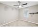 Simple bedroom with ceiling fan and window coverings at 1639 S 82Nd Pl, Mesa, AZ 85209