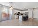 Modern kitchen with white cabinets, granite island, and stainless steel appliances at 1639 S 82Nd Pl, Mesa, AZ 85209