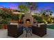 Outdoor fireplace with seating area, perfect for entertaining at 16575 N 109Th Way, Scottsdale, AZ 85255