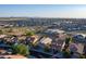 Aerial view of a large community with numerous houses and a park at 1844 S 238Th Ln, Buckeye, AZ 85326