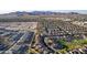Aerial view of a suburban neighborhood featuring houses and mountain views at 1844 S 238Th Ln, Buckeye, AZ 85326