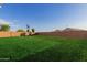 Vast backyard with a charming playhouse, perfect for outdoor fun at 1844 S 238Th Ln, Buckeye, AZ 85326
