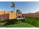 Large grassy backyard with playset and block wall at 1844 S 238Th Ln, Buckeye, AZ 85326