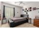 Bedroom with a double bed and wall decor, and a ceiling fan at 1844 S 238Th Ln, Buckeye, AZ 85326