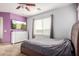 Bedroom with double bed, dresser, and large window with mountain view at 1844 S 238Th Ln, Buckeye, AZ 85326