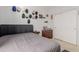 Bedroom with a double bed and various wall decor including hats at 1844 S 238Th Ln, Buckeye, AZ 85326