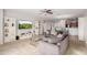 Spacious living room with gray sofas, built in shelving and a large TV at 1844 S 238Th Ln, Buckeye, AZ 85326