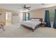 Primary bedroom with king bed and ensuite bathroom at 18611 N 22Nd St # 2, Phoenix, AZ 85024