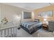 Bright bedroom with striped bedding and crib at 18611 N 22Nd St # 2, Phoenix, AZ 85024