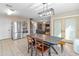 Bright dining room featuring a modern chandelier and views into the living area at 18611 N 22Nd St # 2, Phoenix, AZ 85024