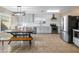 Modern kitchen with white cabinets, stainless steel appliances, and a breakfast nook at 18611 N 22Nd St # 2, Phoenix, AZ 85024