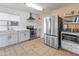 Modern kitchen with stainless steel appliances and a stylish subway tile backsplash at 18611 N 22Nd St # 2, Phoenix, AZ 85024