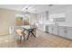 Modern kitchen with white cabinets, stainless steel appliances and breakfast nook at 18611 N 22Nd St # 2, Phoenix, AZ 85024