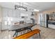Modern kitchen with white cabinets, stainless steel appliances, and a breakfast nook at 18611 N 22Nd St # 2, Phoenix, AZ 85024
