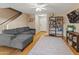 Living room with gray sectional sofa, hardwood floors, and ceiling fan at 18611 N 22Nd St # 2, Phoenix, AZ 85024