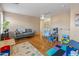 Playroom with hardwood floors, gray couch, and toys at 18611 N 22Nd St # 2, Phoenix, AZ 85024
