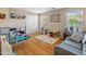 Playroom with hardwood floors, gray couch, and toys at 18611 N 22Nd St # 2, Phoenix, AZ 85024
