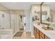 Spa-like bathroom with double vanity and a walk-in shower at 1923 N Cocoa Ct, Casa Grande, AZ 85122
