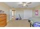 Bedroom with a dresser, sliding doors, and view of another room at 1923 N Cocoa Ct, Casa Grande, AZ 85122