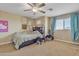 Bedroom with a bed, ceiling fan, and window coverings at 1923 N Cocoa Ct, Casa Grande, AZ 85122