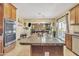 Island kitchen with stainless steel appliances and ample counter space at 1923 N Cocoa Ct, Casa Grande, AZ 85122