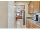 Walk-through kitchen pantry with extra counter space and storage at 1923 N Cocoa Ct, Casa Grande, AZ 85122