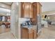Kitchen with built-in appliances and dark wood cabinetry at 1923 N Cocoa Ct, Casa Grande, AZ 85122