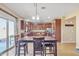 Kitchen with table for four, stainless steel appliances, and patio access at 1923 N Cocoa Ct, Casa Grande, AZ 85122