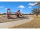 Community playground with playset and walking path at 1923 N Cocoa Ct, Casa Grande, AZ 85122
