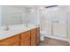 Bathroom features double sinks, wood cabinets and a shower/tub combo at 2020 W Union Hills Dr # 201, Phoenix, AZ 85027