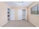 Bedroom with carpet flooring, ceiling fan and double door closet at 2020 W Union Hills Dr # 201, Phoenix, AZ 85027