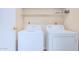 Bright laundry room, features washer and dryer, and shelving for storage at 2020 W Union Hills Dr # 201, Phoenix, AZ 85027