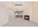 Bright living room with a fireplace and kitchen view at 2020 W Union Hills Dr # 201, Phoenix, AZ 85027