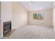 Living room with fireplace and large window at 2020 W Union Hills Dr # 201, Phoenix, AZ 85027