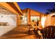 Inviting backyard with fire pit and patio seating at night at 2230 N 87Th Ter, Scottsdale, AZ 85257