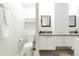 Bright bathroom boasts double vanity, updated fixtures and large linen closet at 2230 N 87Th Ter, Scottsdale, AZ 85257