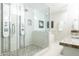 Spa-like bathroom with a large walk-in shower, double vanity, and soaking tub at 2230 N 87Th Ter, Scottsdale, AZ 85257
