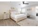 Spacious bedroom with plush bed, light walls, and a ceiling fan at 2230 N 87Th Ter, Scottsdale, AZ 85257