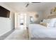 Bright and airy bedroom with king-size bed and views of additional rooms at 2230 N 87Th Ter, Scottsdale, AZ 85257