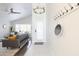 Bright entryway with tile flooring, coat rack and living room view at 2230 N 87Th Ter, Scottsdale, AZ 85257