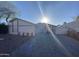 White single story home with landscaped front yard and paved driveway at 2230 N 87Th Ter, Scottsdale, AZ 85257