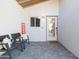 Inviting front entry with seating area and decorative sign at 2230 N 87Th Ter, Scottsdale, AZ 85257