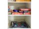 Well-organized game closet with various board games at 2230 N 87Th Ter, Scottsdale, AZ 85257