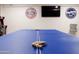 Basement game room features ping pong table and vintage car decor at 2230 N 87Th Ter, Scottsdale, AZ 85257