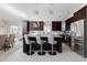 Updated kitchen boasts dark wood cabinets and a large island at 2230 N 87Th Ter, Scottsdale, AZ 85257